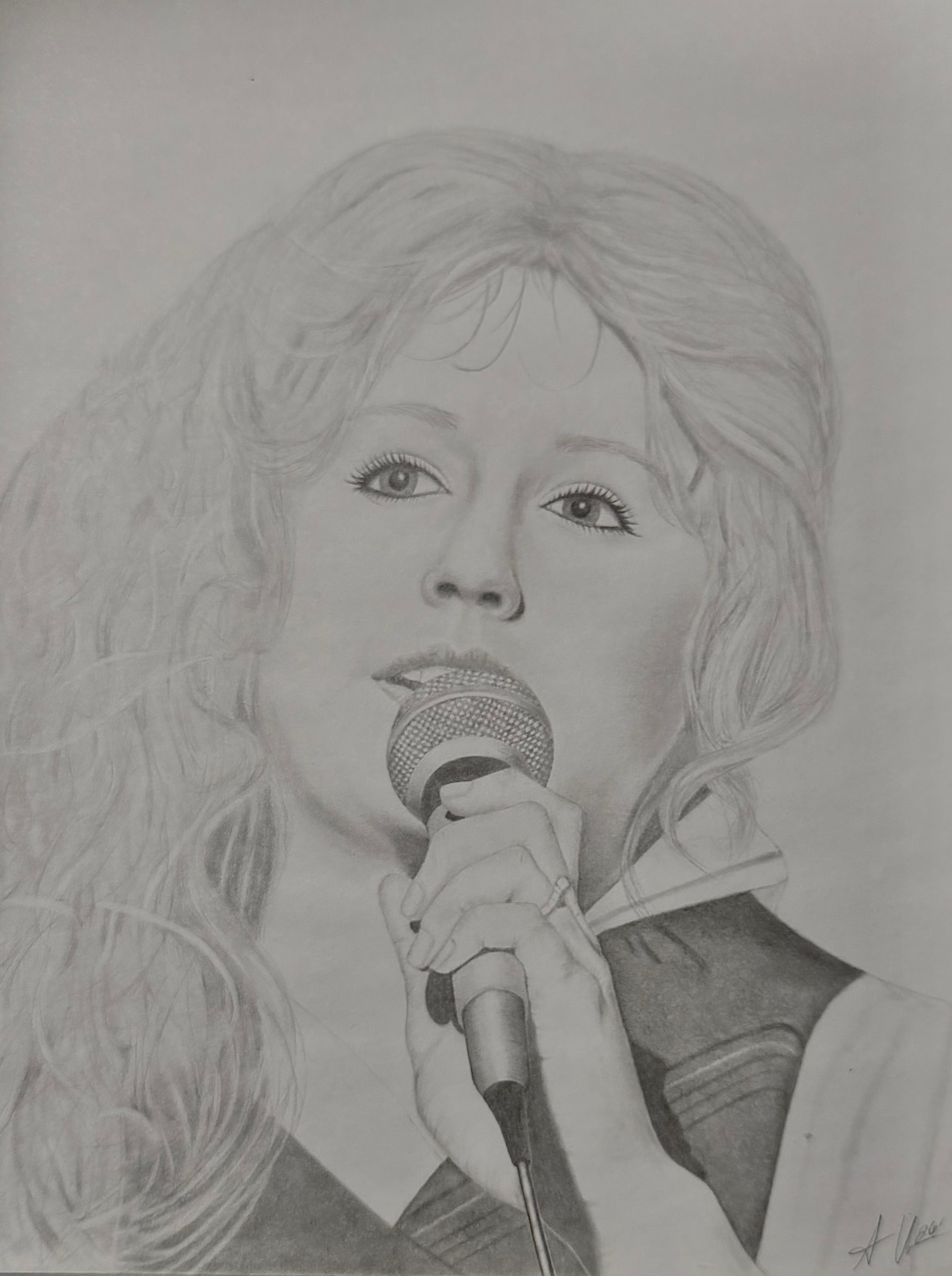 Graphite portrait of a singer holding a microphone