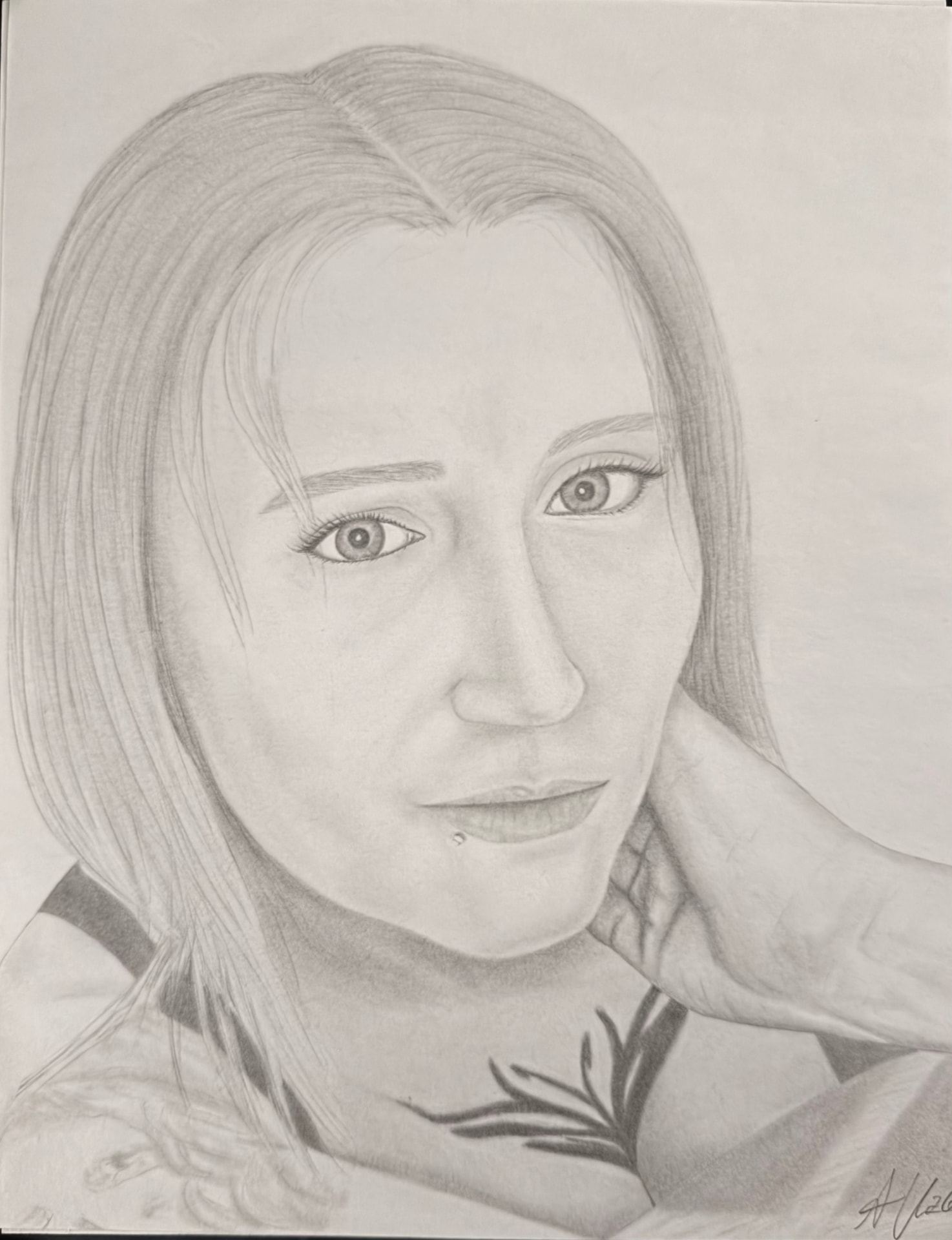 Graphite portrait of a woman resting her chin on her hand
